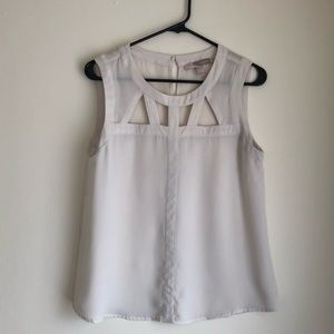 Ivory sleeveless cut out blouse